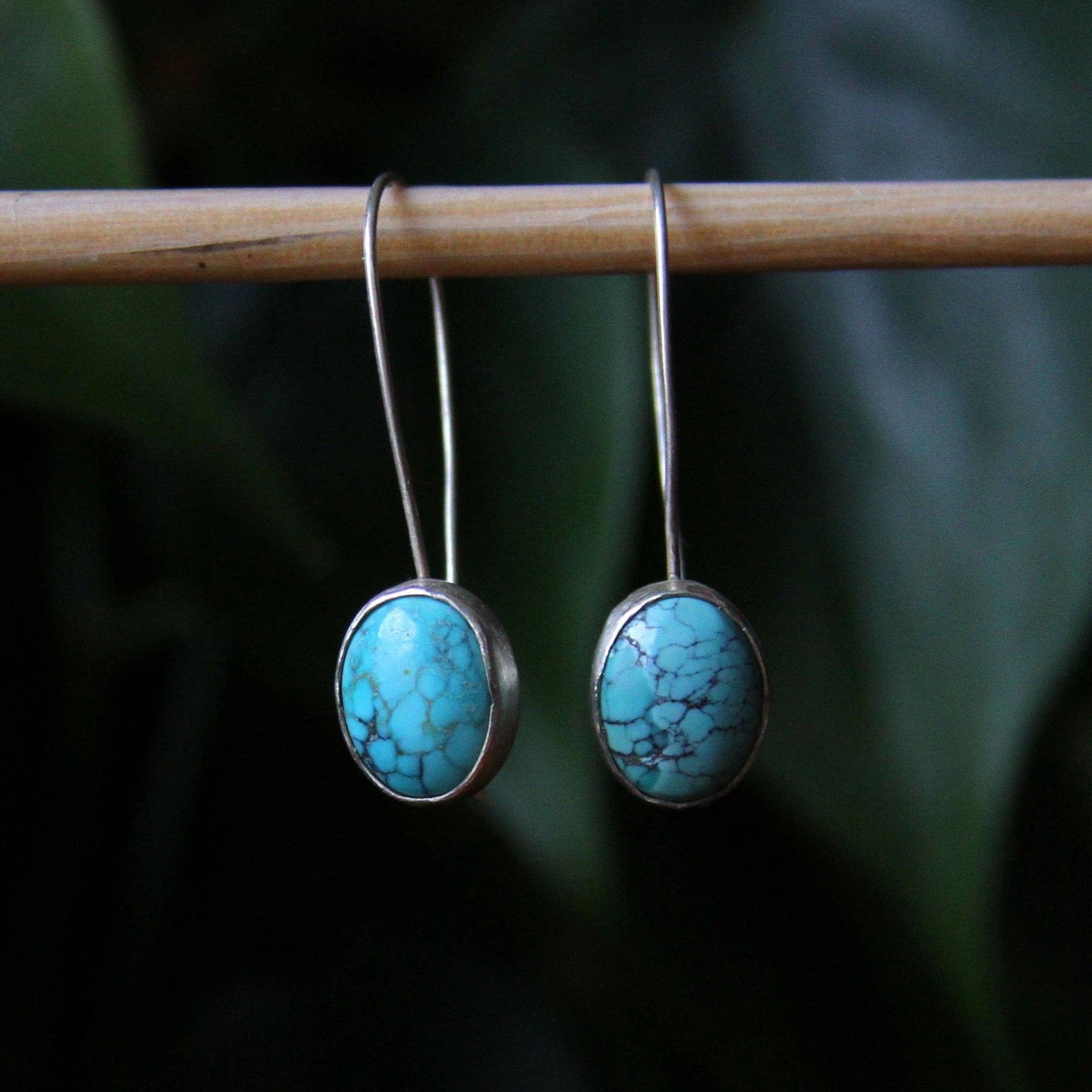 Turquoise oval earrings in sterling store silver.